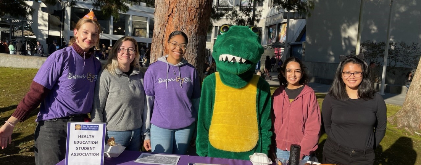 HESA members behind table with Gator